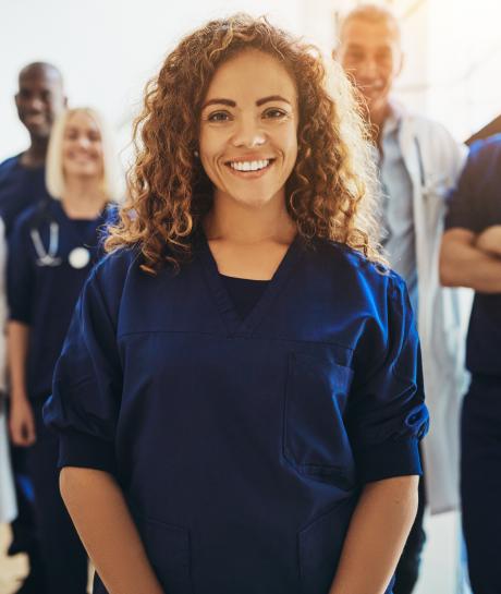 FemaleNurseStandingInGroup