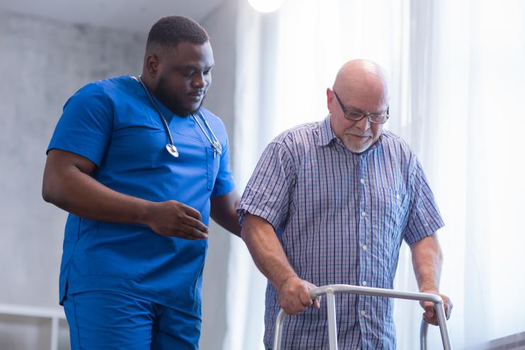 Nurse walking with patient.