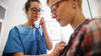 Nurse using stethoscope