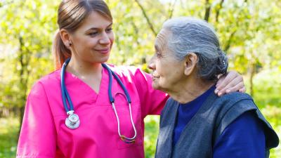 Nurse and patient outdoors