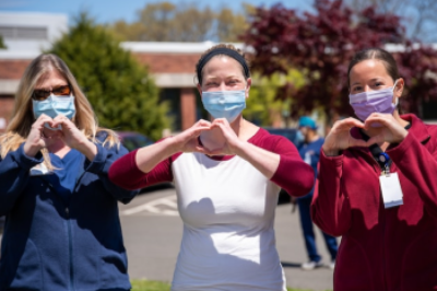 Nurses making hearts with their hands