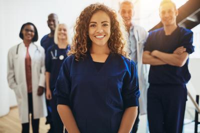 FemaleNurseStandingInGroup