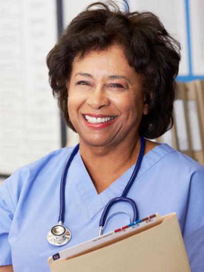 Older nurse with file