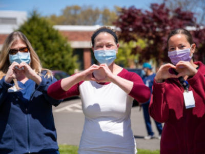 Nurses making hearts with their hands