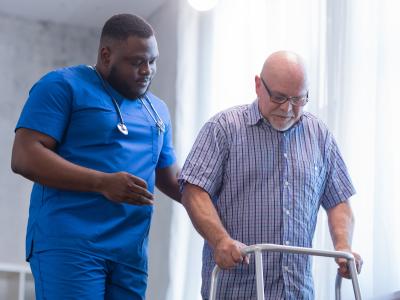 Nurse walking with patient.