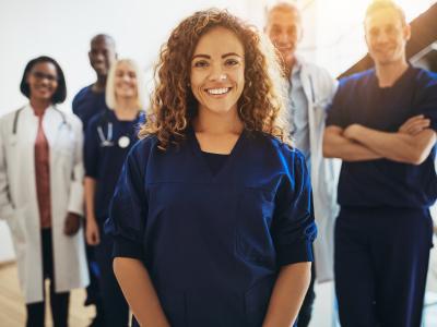FemaleNurseStandingInGroup