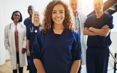 FemaleNurseStandingInGroup